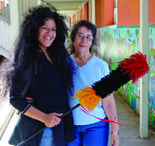 Daughter Natalie Mahina Jensen-Oomuttuk and mother, Lucia Tarallo Jensen, co-authored the book Daughters of Haumea, which won the Palapala Po’okela Award of Excellence in 2006. Natalie holds one of her kāhili, or soft feather sculptures.