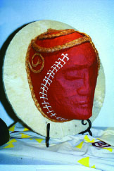 A collaboration by Rocky and Lucia Jensen, called Hanaumea. It is mask made of kapa and sennit.