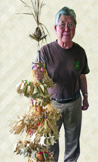 Art Murata with display of his specialty: lauhala ornaments. photo by Karen Valentine