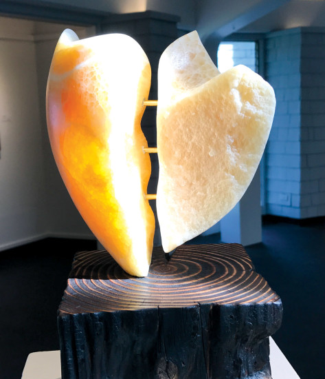 "Beautifully Broken" in stone and wood by John Strohbehn was awarded the Acquisitions Recognition Award.