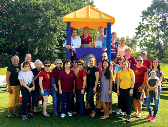 Zonta Club members at the completion of the playground equipment build out for Child and Family Services. photo courtesy of Zonta Club of Hilo