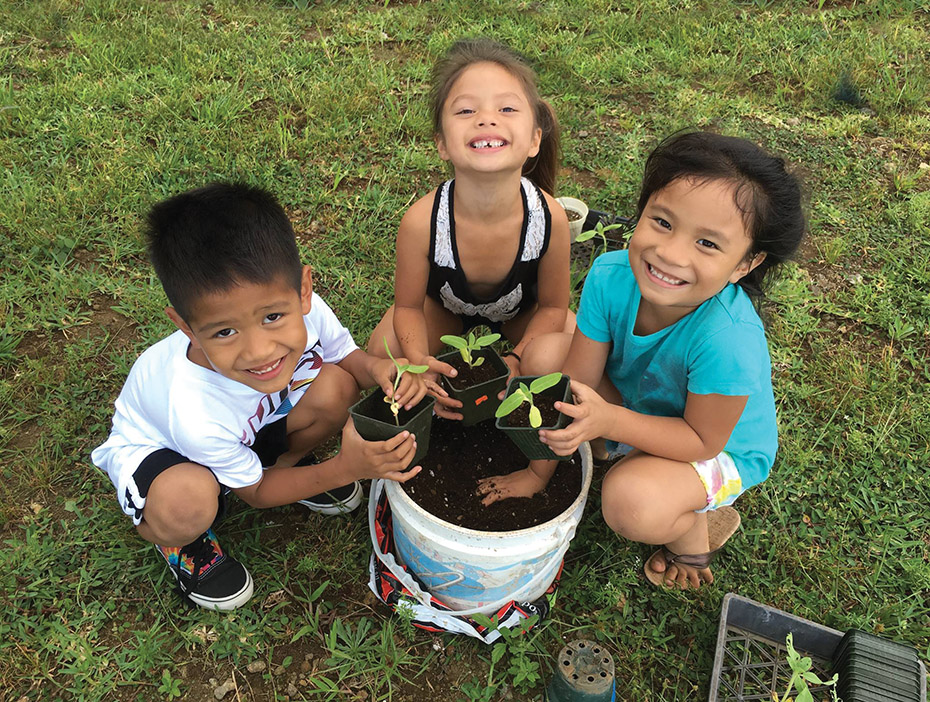 Keiki learning about agriculture in the Keiki Garden. photo courtesy of Lori Beach