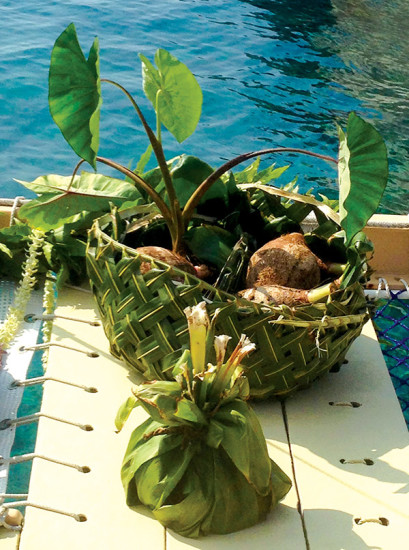Ti leaf baskets left as offering gifts on the Hōkūle’a. photo by Gayle Greco