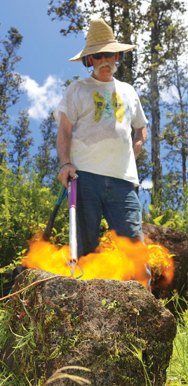 William melting basalt back into lava with his 5,000 degree flame thrower. photo courtesy of Joseph Ruesing