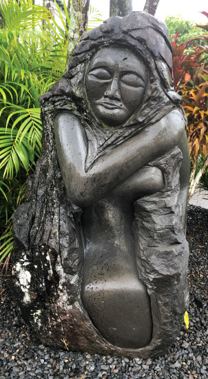 William’s sculpture Life Taken Away is a woman lamenting the loss of her children in front of the Pacific Tsunami Museum on a rainy Hilo day. photo by Paula Thomas