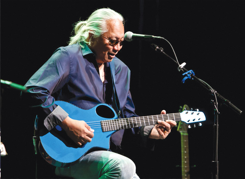 Brother Noland performs with his signature blue guitar at the Hawaii Theatre. photo courtesy of James Kimo Garrett
