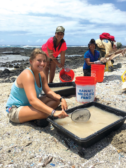 A school group hosted by Hawai‘i Wildlife Fund skims a water sample for microplastics. photo courtesy Megan Lamson 