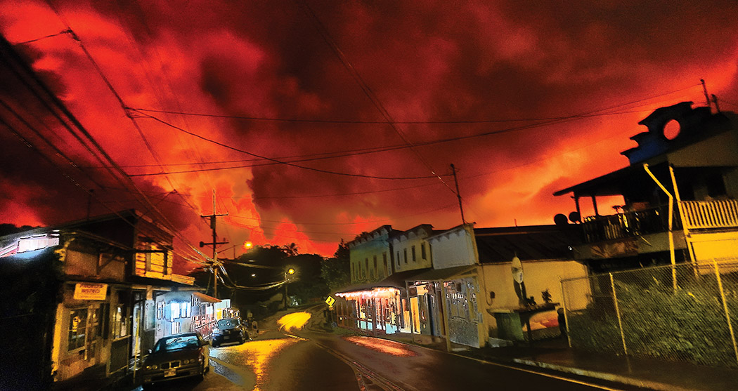 Old Town Pāhoa Village with lava glow backdrop, July 2018. photo courtesy of Kornelius Shorle