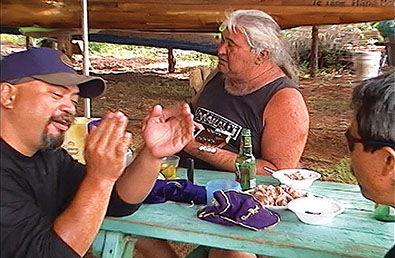 Clay playing ‘ukulele and singing “Mauna Kea” at a party given by Uncle Robert for the crew of Makali‘i in Hāna, Maui