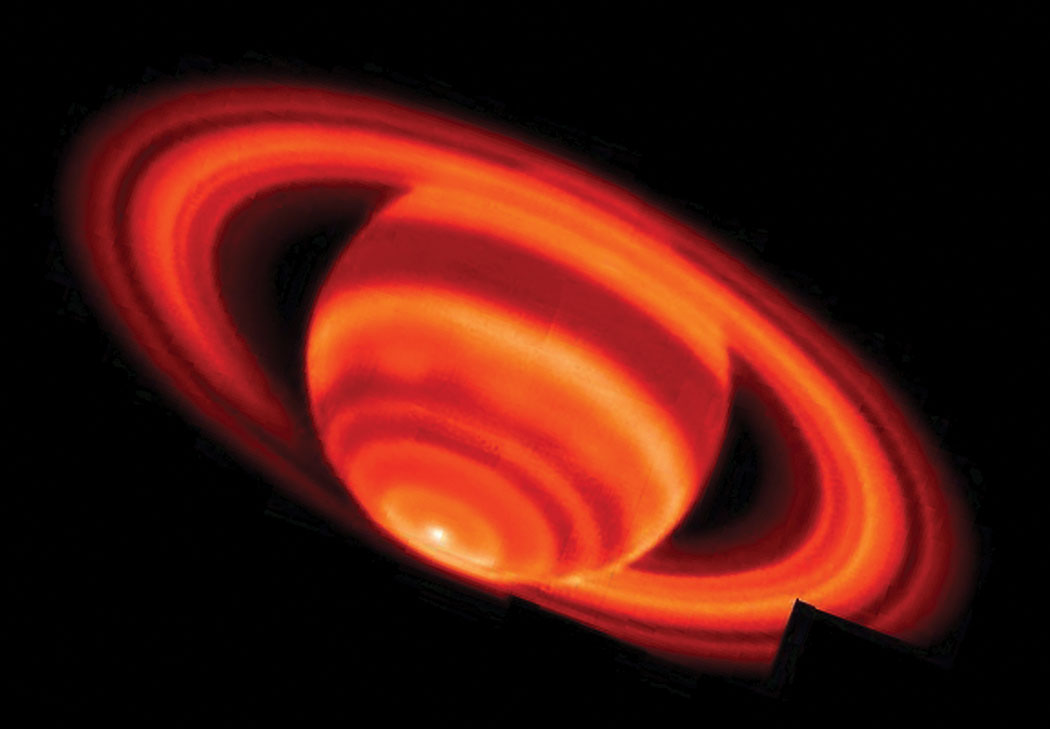 Mosaic false-color image of thermal heat emission from Saturn and its rings taken on February 4, 2004, with the Keck I telescope at 17.65 micron wavelengths. The black square at 4 o’clock represents missing data. photo credit: W.M Keck Observatory/NASA/JPL-G.Orton