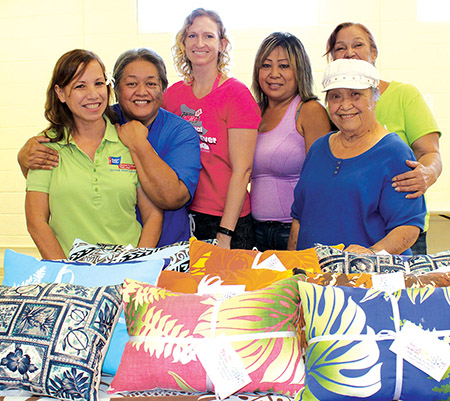 Members of the Hui Mālama Cancer Support Group, Mālama Ka Pili Pa‘a, with handmade pillows for their Hope Pillow Project for cancer patients in treatment.