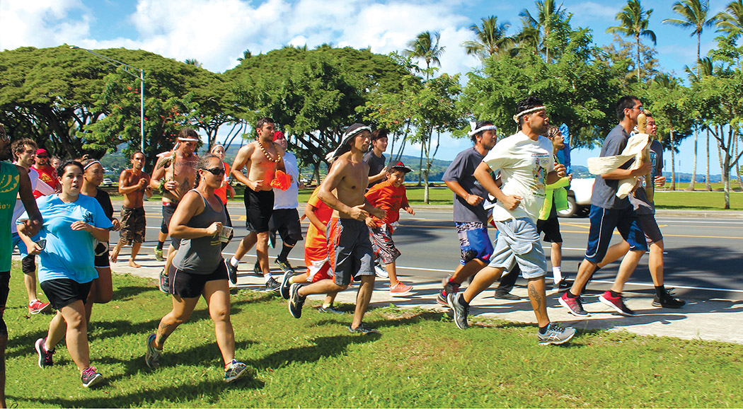 Runners who started running the Hāmākua coast at dawn arrive in Hilo by midday to bring the combined prayer to the foot of the Kamehameha Statue.
