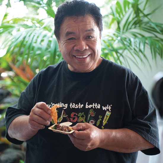 Chef Sam Choy, who put poke on the culinary map, taste tests an entry during a past Keauhou Poke Contest. photo courtesy of Kirk Shorte