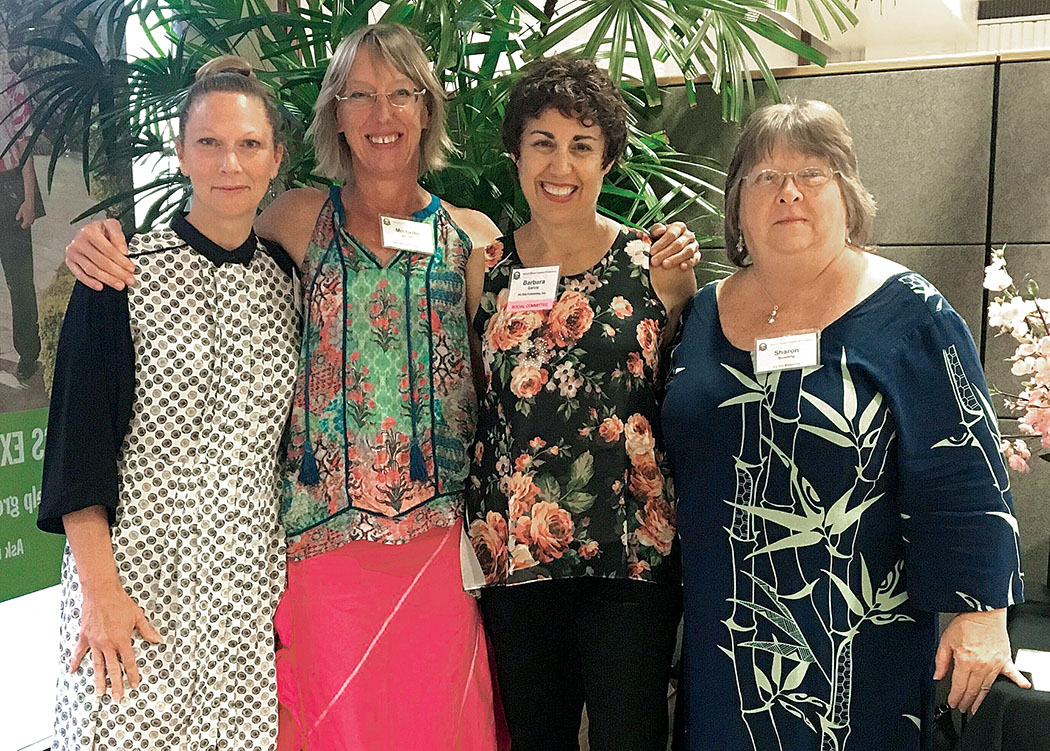 Laura Ruff, co-distribution manager; Michelle Sandell, graphic artist, webmistress and publisher's assistant; Barbara Garcia, publisher; and Sharon Bowling, former editorial assistant and subscription manager in February, 2018 at a Hawai‘i Island Chamber of Commerce AfterHours they co-hosted with the staff of Central Pacific Bank.