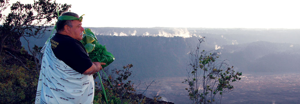 Kumu Hula Etua Lopes offering ho‘okupu at Halema‘uma‘u crater Kīlauea Volcano, 2013.