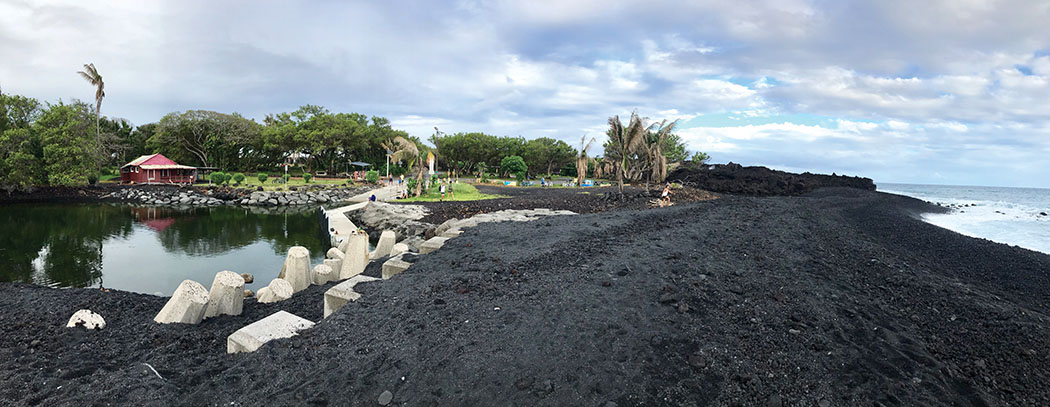 The new black sand beach encloses the former boat launch ramp at Pohoiki. photo courtesy of Barbara Garcia