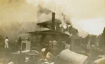1940 fire started in the kitchen at west end of building. Note the direction of smoke is almost due south. Hawai‘i Volcanoes National Park Photograph Collection