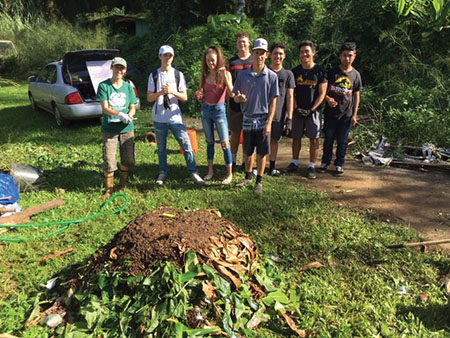The AP biology class at the high school farm in December 2018 after building a Berkeley 18 Day Hot Compost Pile. photo courtesy of Julia Meurice