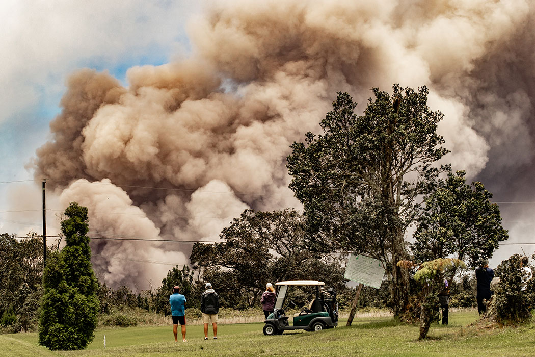 Golfers at Volcano Golf Course watch in awe of one of the many ash explosions that happened daily for weeks.