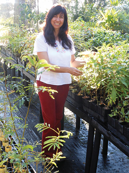 Jill Wagner propagates plants at her nursery.
