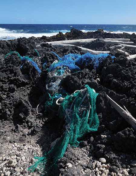Plastic marine debris caught in North Pacific Gyre ocean currents regularly washes up on Hawai‘i Island’s rocky southern beaches. photo by Stefan Verbano