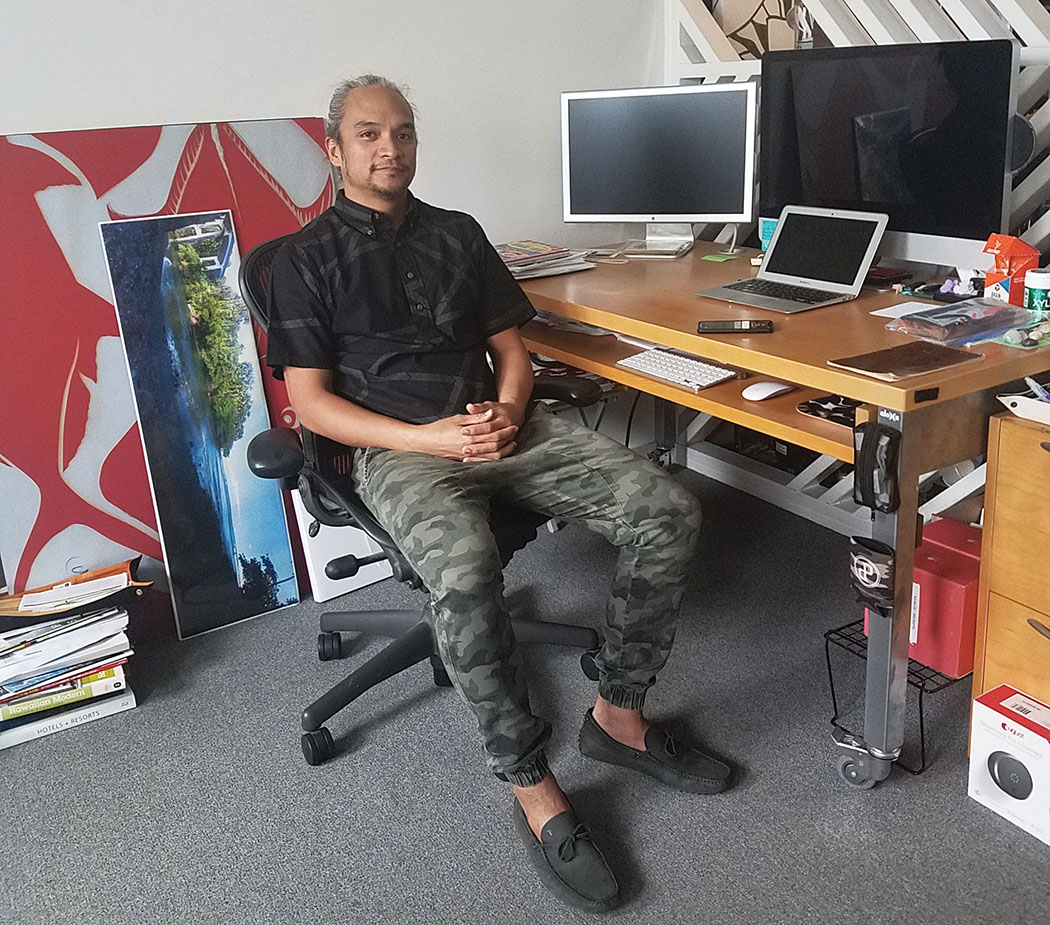 Kūhao in his office at SZ Designs. photo by Marcia Timboy