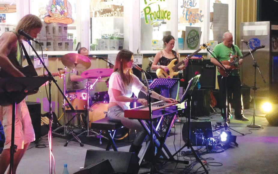 One of Russell's bands playing outside the Pāhoa Island Naturals store at a Second Saturday event in Pāhoa. photo courtesy of Russell Ruderman