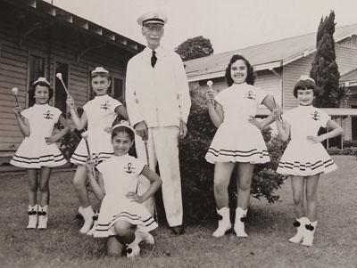 Uncle Bill Rickard and the HHIS majorettes (left to right) Linda Teves, Beverly Awong, Paula Enaoria, Laurie Ann Cypriano, Alberta Branco. photo courtesy of Awong Family Collection, NHERC Heritage Center