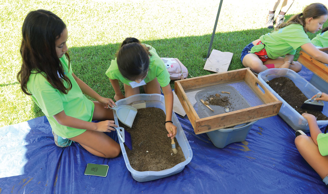 Girls learning archaeology at a GEMS event. photo courtesy of AAUW Kona Branch