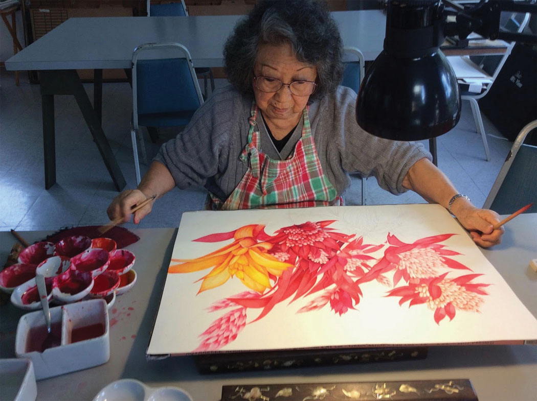 Jane creating a watercolor on silk in her Studio Mountain View home. photo courtesy of Jane Chao
