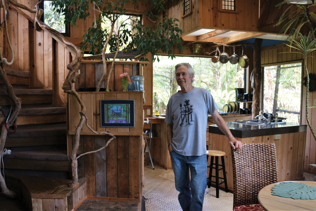 Treehouse aficionado Skye Peterson in one of his creations in the treetops. photo by Lara Hughes