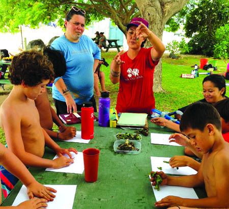 Nä Kilo ‘Āina participants get hands-on lessons in reef life. photo courtesy of Diane Kaneali‘i