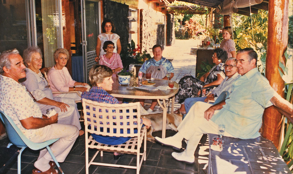 The covered lanai of the McCoy house, built in 1963, using post and beam construction with koa and ‘ohi‘a, offered a congenial setting for friendly gatherings at the home of the well-known Kona veterinarian. The house doubled as a clinic in those days.