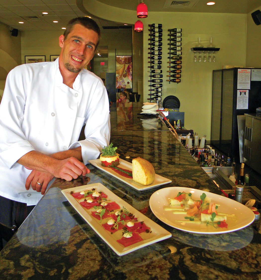 Chef Joshua Ketner with a trio of appetizers.