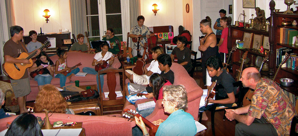 The popular, annual slack key guitar/‘ukulele masters’ workshop draws students from all over. Above, Keoki Kahumoku teaches a guitar class.