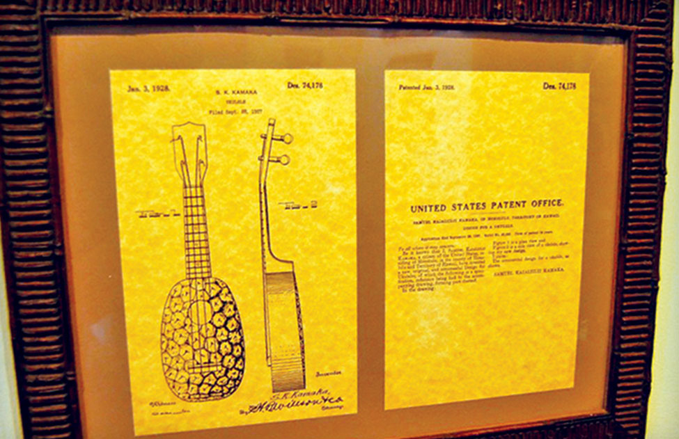 Historic posters, photographs and clippings from various publications share the wall space, creating a sort of still-life documentary of the instrument’s evolution over the years. This historically important document is the U.S. Patent for Kamaka’s “Pineapple ‘Ukulele.” 