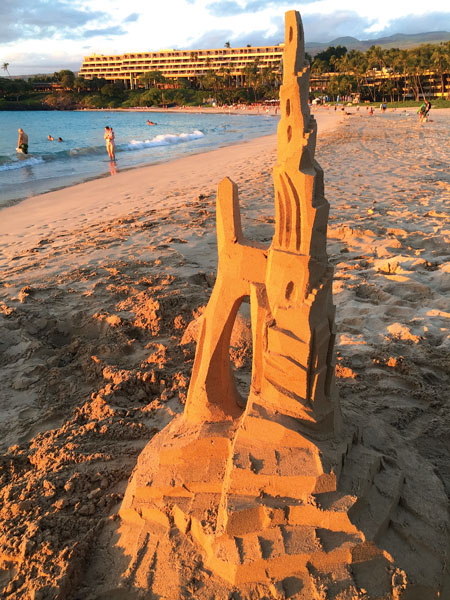 Mike loves to work on the Kohala Coast beaches, where sands are older and less coarse. This spire stands before Kaunaÿoa Bay. photo courtesy of Mike and Nancy Radtke