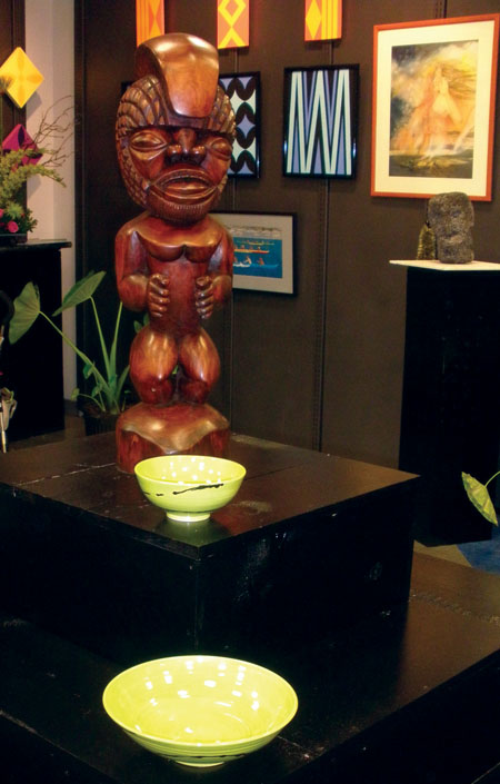 Gallery display, featuring koa ki‘i carving by Rocky Vargas.