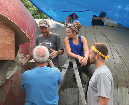 Domegaia participants work on a window at a recent workshop in Kalapana. photo by Mālielani Larish