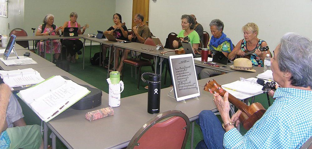 The Tuesday morning ‘ukulele group gathers weekly to share music, laughter, and lunch. photo by Jan Wizinowich
