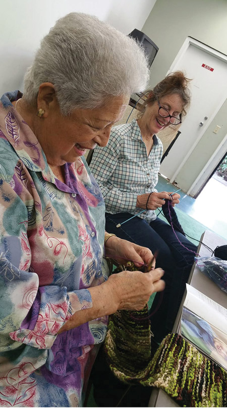 Running for more than 10 years, Gretchen Geisler has led the knitting group with creativity and fellowship, here with January Heron. photo courtesy of FOF