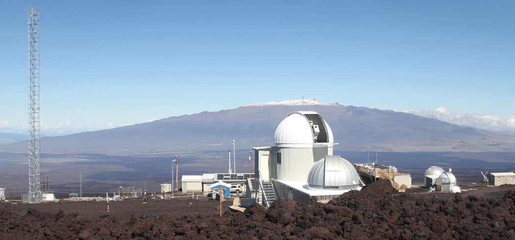 The Mauna Loa Observatory site, with carbon dioxide sampling tower to the left, and Mauna Kea in the distance. photo courtesy of NOAA