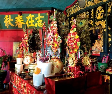 Main altar with traditional lunar new year offerings. photo by Barbara Garcia
