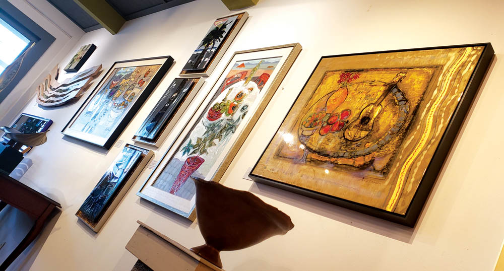 Paintings and sculptures hang on the walls and catch the light that floods Gary’s gallery. photo by Sara Stover