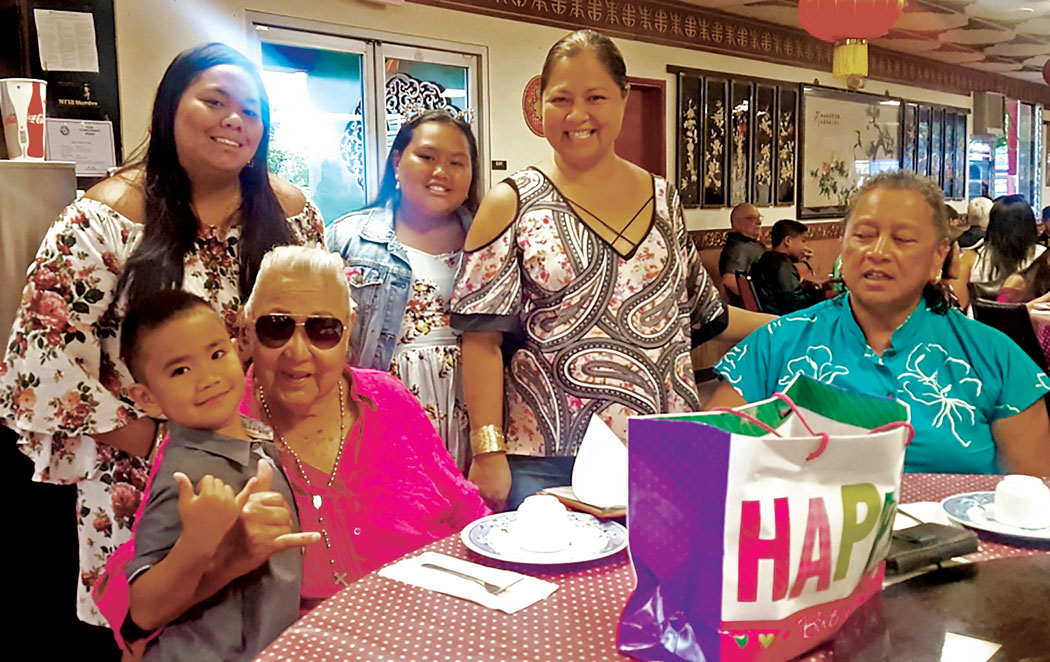 Mauhili family celebrates Aunty Maile’s 84th birthday. In front: Aunty Maile holds great-grandson James Mauloa Kamaka-Mauhili. Standing behind, from left: great-granddaughters Makamae and Jaselle Kamaka-Mauhili, granddaughter Kanoe Mauhili-Kamaka and daughter Aloha Mauhili. photo courtesy of the Mauhili family