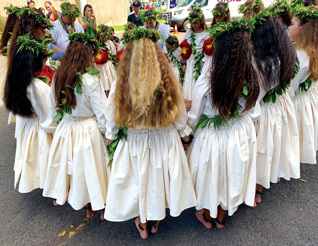 A pre-performance pule (prayer) with students at the 2019 Prince Lot Festival at ‘Iolani Palace. 